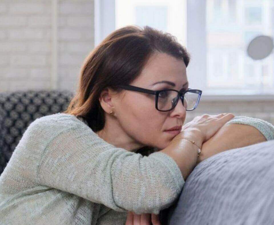 Depressed woman with eyeglasses